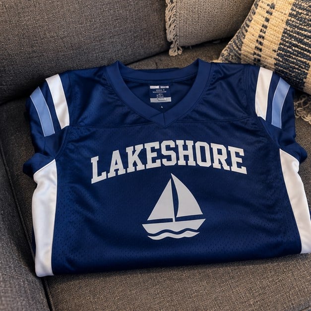Customer photo of a custom football jersey on a couch